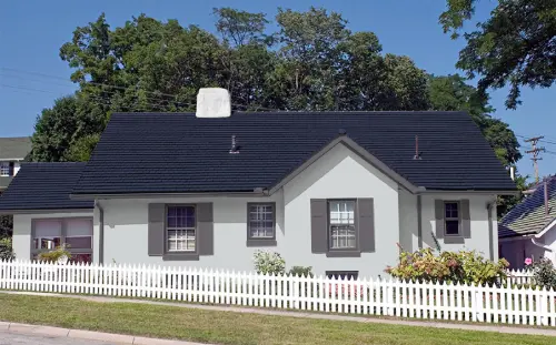 Home exterior painted in 'Oyster Bar' warm white - resists yellowing in Oklahoma sun